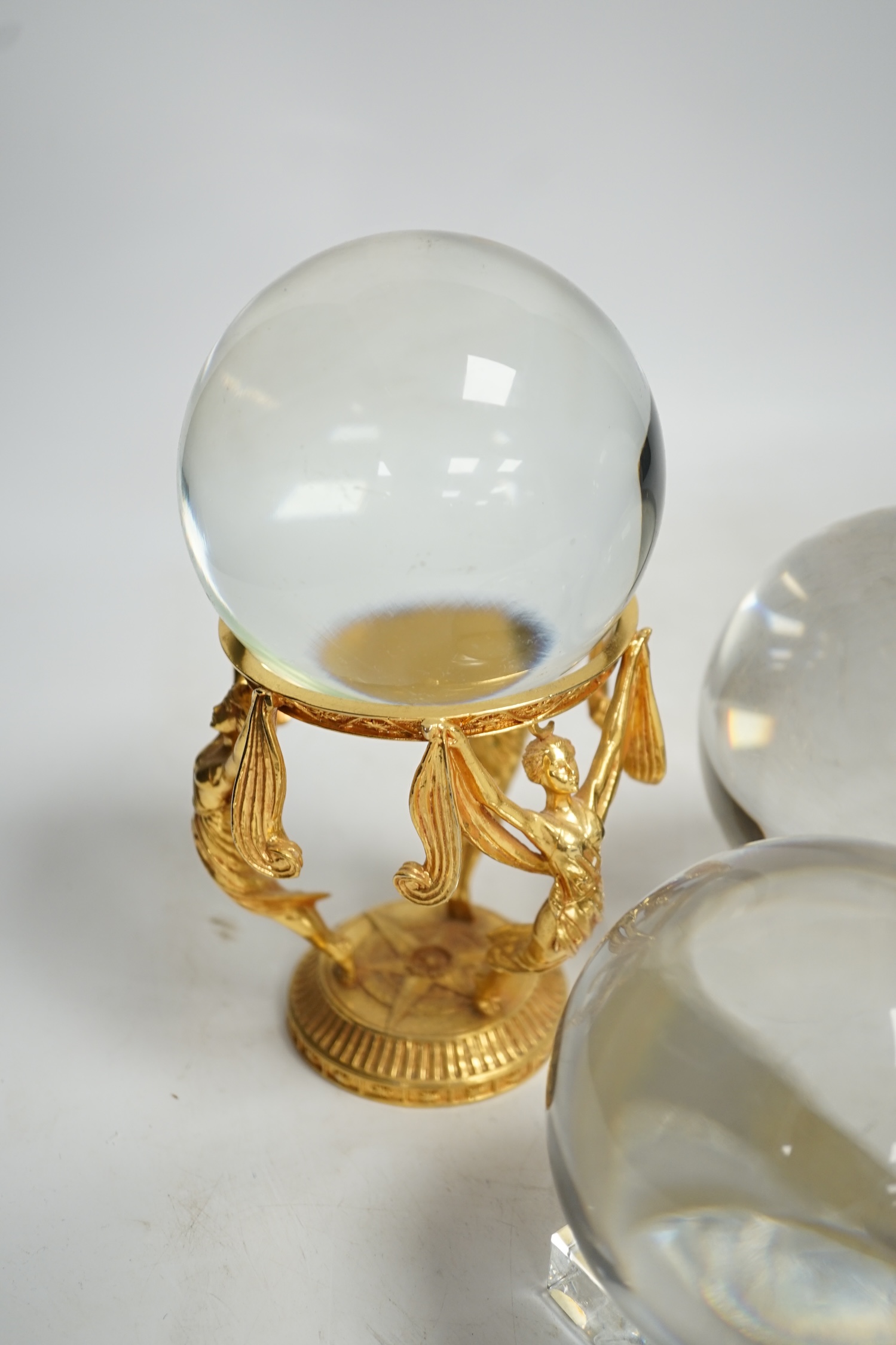 A group of six crystal balls on stands, largest 14cm across. Condition - fair